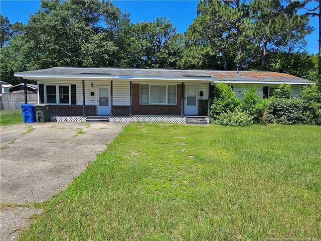 1918 Roxie Ave, Fayetteville, NC 28304 - single story home featuring a porch, a front lawn, brick siding, and driveway