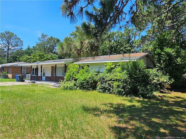 1918 Roxie Ave, Fayetteville, NC 28304 - view of front of home with a porch and a front yard