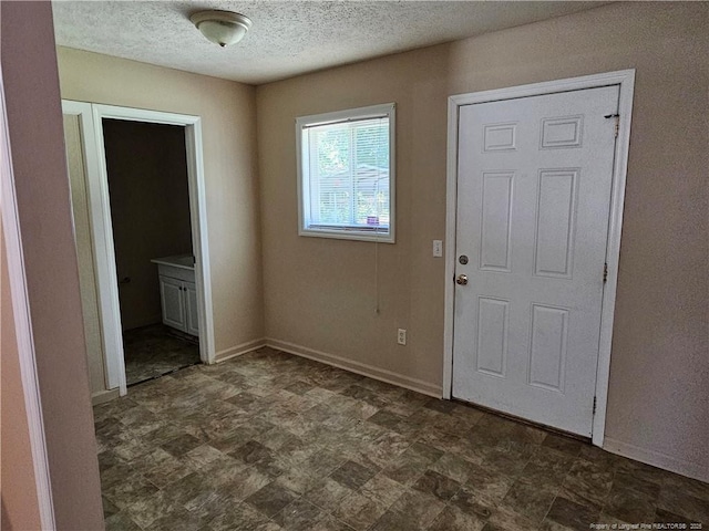 1918 Roxie Ave, Fayetteville, NC 28304 - entryway with baseboards and a textured ceiling
