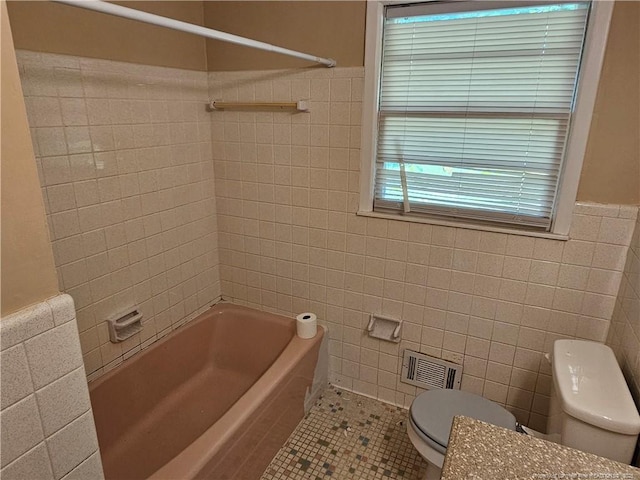 1918 Roxie Ave, Fayetteville, NC 28304 - bathroom with tile walls, tile patterned flooring, shower / bathtub combination, and wainscoting