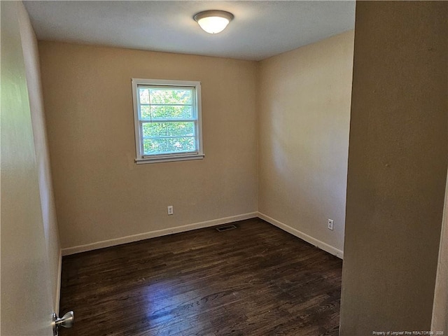 1918 Roxie Ave, Fayetteville, NC 28304 - empty room featuring dark wood-type flooring and baseboards