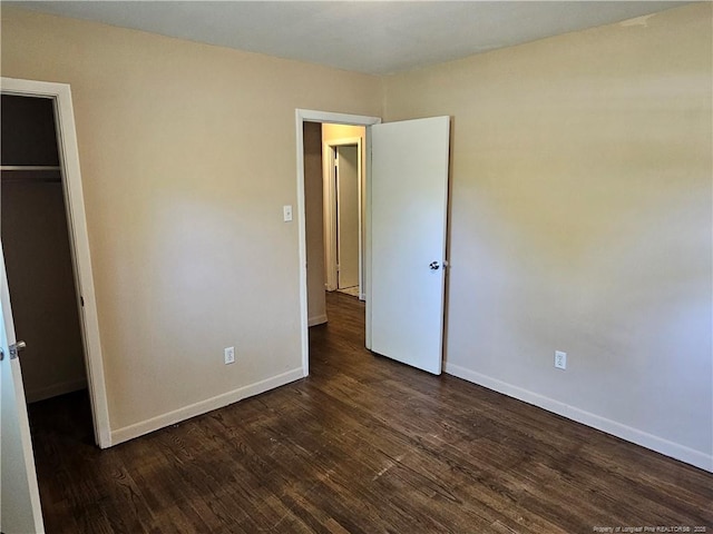 1918 Roxie Ave, Fayetteville, NC 28304 - unfurnished bedroom featuring dark wood finished floors and a closet