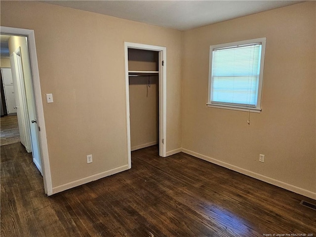 1918 Roxie Ave, Fayetteville, NC 28304 - unfurnished bedroom with dark wood-style flooring and a closet