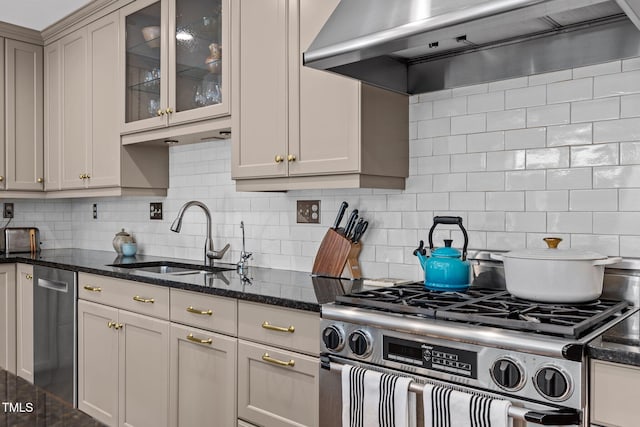 2706 Stuart Dr, Durham, NC 27707 - kitchen with stainless steel appliances, extractor fan, decorative backsplash, and dark stone counters