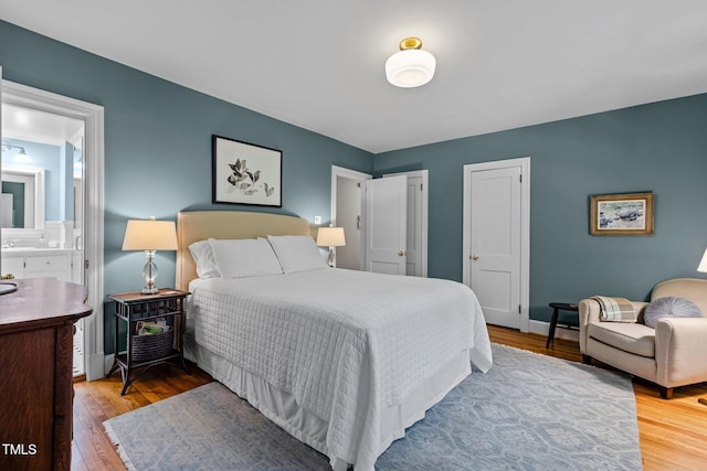 2706 Stuart Dr, Durham, NC 27707 - bedroom with wood finished floors and two closets