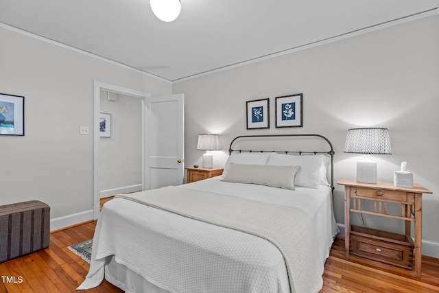 2706 Stuart Dr, Durham, NC 27707 - bedroom featuring hardwood / wood-style floors and crown molding