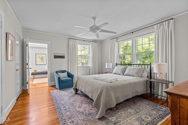 2706 Stuart Dr, Durham, NC 27707 - bedroom featuring light wood-style floors, a ceiling fan, and crown molding