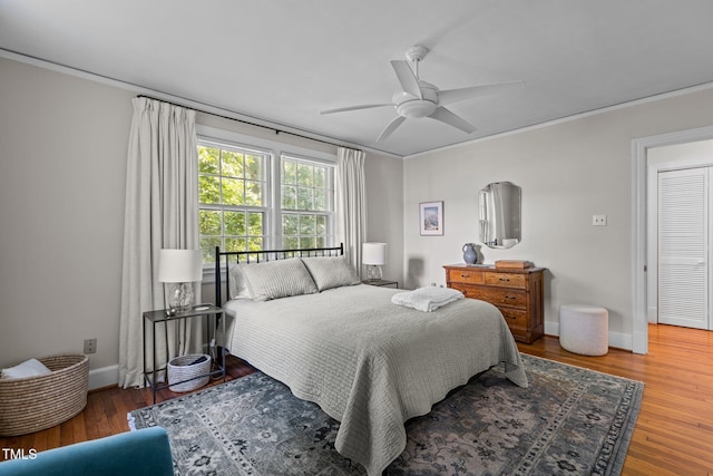 2706 Stuart Dr, Durham, NC 27707 - bedroom with crown molding, wood finished floors, and ceiling fan