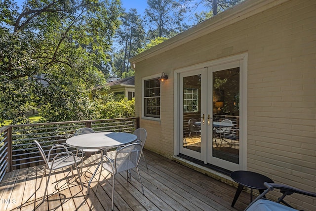 2706 Stuart Dr, Durham, NC 27707 - wooden deck with french doors and outdoor dining space
