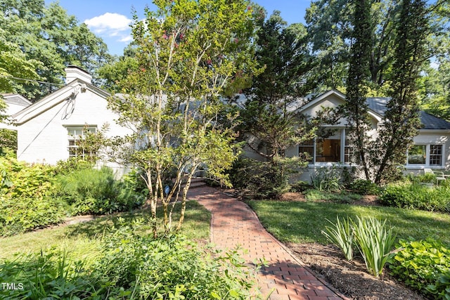 2706 Stuart Dr, Durham, NC 27707 - obstructed view of property with a chimney