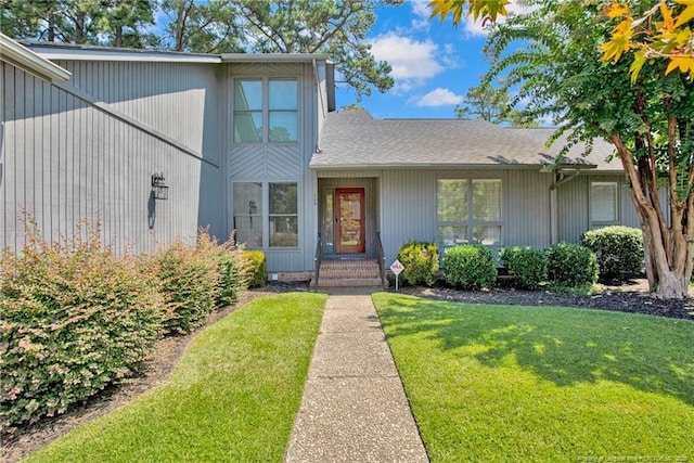106 Woodrow St, Fayetteville, NC 28303 - view of front of property with a front lawn and a shingled roof