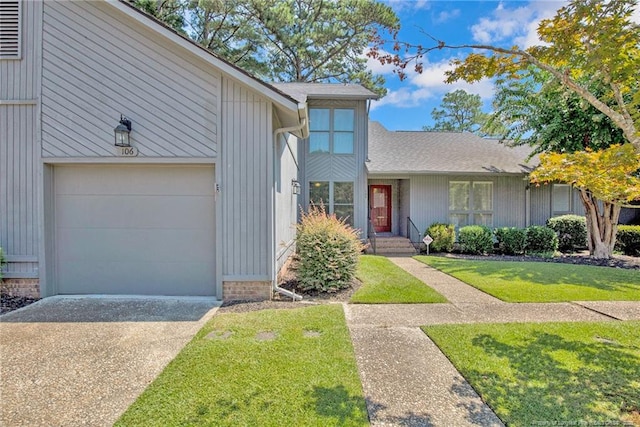 106 Woodrow St, Fayetteville, NC 28303 - view of front of property featuring a front lawn, concrete driveway, and roof with shingles
