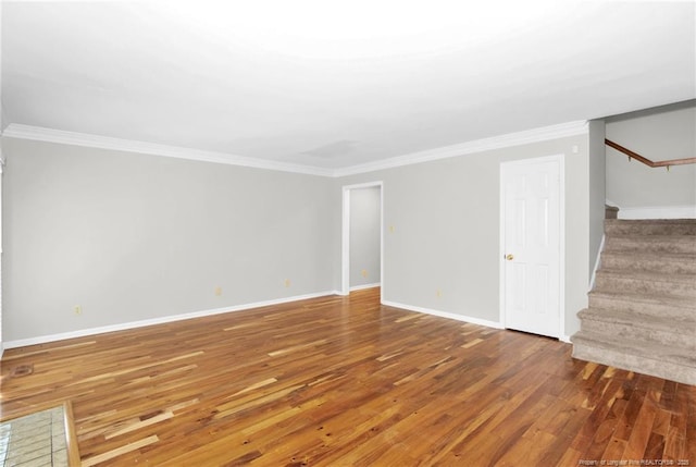 106 Woodrow St, Fayetteville, NC 28303 - unfurnished living room featuring stairway, crown molding, and wood finished floors