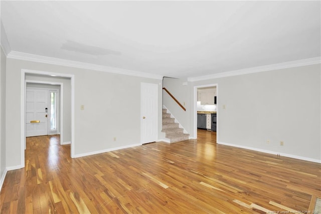 106 Woodrow St, Fayetteville, NC 28303 - unfurnished living room featuring stairway, light wood-type flooring, and crown molding