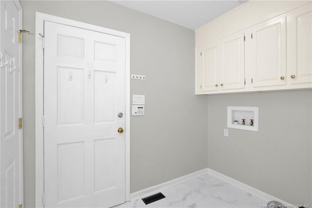 106 Woodrow St, Fayetteville, NC 28303 - laundry area featuring hookup for a washing machine, cabinet space, and light marble finish flooring