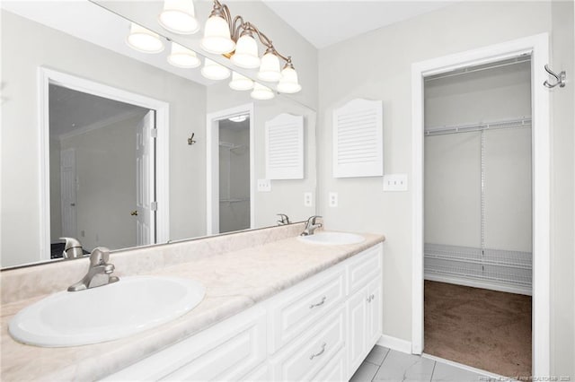 106 Woodrow St, Fayetteville, NC 28303 - bathroom featuring double vanity, a walk in closet, and a shower