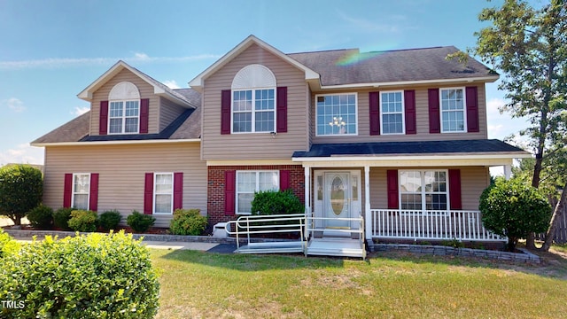 14 Gloucester Ct, Cameron, NC 28326 - view of front facade featuring a porch, a front yard, and a shingled roof