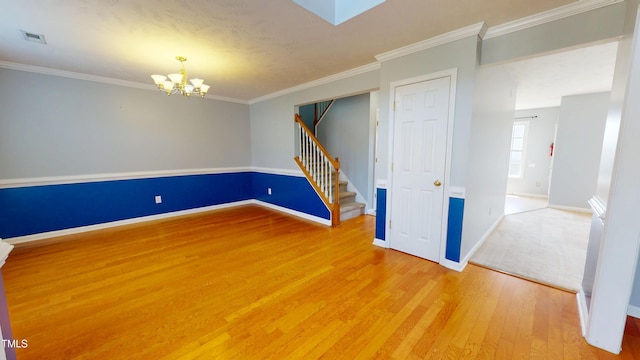 14 Gloucester Ct, Cameron, NC 28326 - empty room with a chandelier, wood finished floors, stairs, and ornamental molding