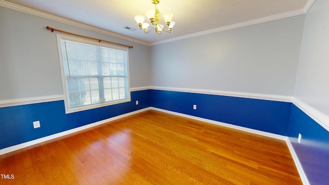 14 Gloucester Ct, Cameron, NC 28326 - unfurnished room with a chandelier, wood finished floors, and crown molding