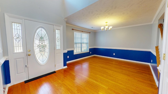 14 Gloucester Ct, Cameron, NC 28326 - foyer entrance with a chandelier, wood finished floors, crown molding, and a textured ceiling