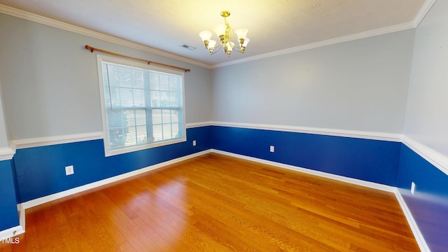 14 Gloucester Ct, Cameron, NC 28326 - spare room with wood finished floors, a chandelier, and ornamental molding