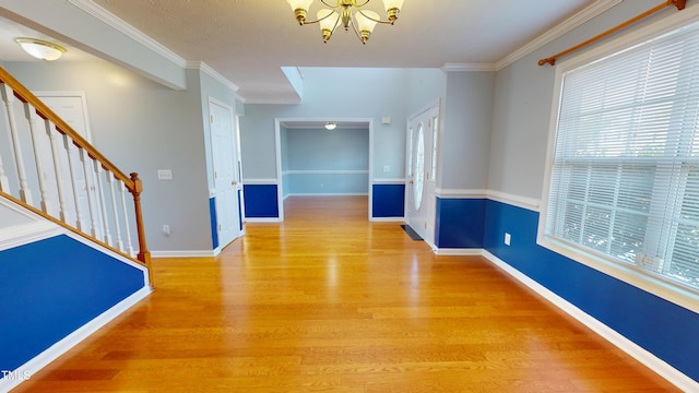 14 Gloucester Ct, Cameron, NC 28326 - unfurnished dining area featuring wood finished floors, a chandelier, stairway, and crown molding