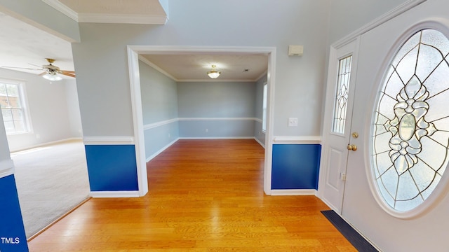 14 Gloucester Ct, Cameron, NC 28326 - foyer entrance featuring wood finished floors, crown molding, and a ceiling fan