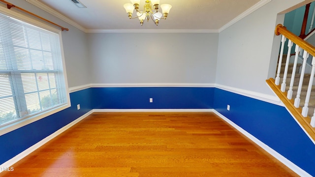 14 Gloucester Ct, Cameron, NC 28326 - spare room with a chandelier, wood finished floors, stairway, and ornamental molding