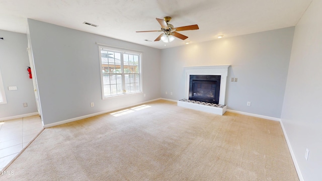 14 Gloucester Ct, Cameron, NC 28326 - unfurnished living room featuring ceiling fan, carpet floors, and a glass covered fireplace