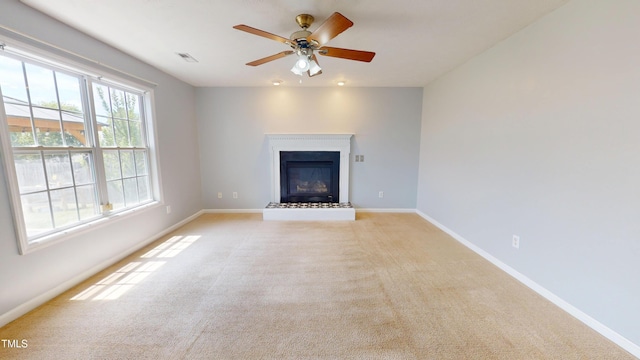 14 Gloucester Ct, Cameron, NC 28326 - unfurnished living room featuring light carpet, ceiling fan, and a glass covered fireplace