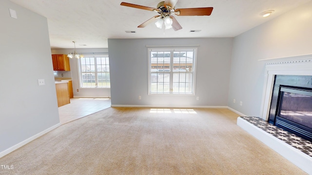 14 Gloucester Ct, Cameron, NC 28326 - unfurnished living room featuring light carpet, a glass covered fireplace, healthy amount of natural light, and a chandelier