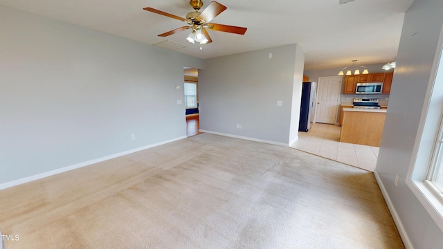 14 Gloucester Ct, Cameron, NC 28326 - unfurnished living room with a chandelier, light carpet, plenty of natural light, and ceiling fan