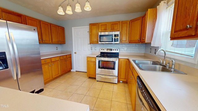 14 Gloucester Ct, Cameron, NC 28326 - kitchen featuring appliances with stainless steel finishes, decorative backsplash, light countertops, and brown cabinets