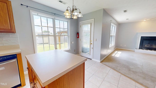 14 Gloucester Ct, Cameron, NC 28326 - kitchen with a glass covered fireplace, a chandelier, dishwasher, light countertops, and light carpet