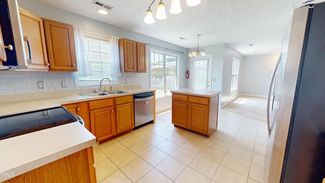 14 Gloucester Ct, Cameron, NC 28326 - kitchen with stainless steel appliances, a chandelier, tasteful backsplash, and brown cabinetry