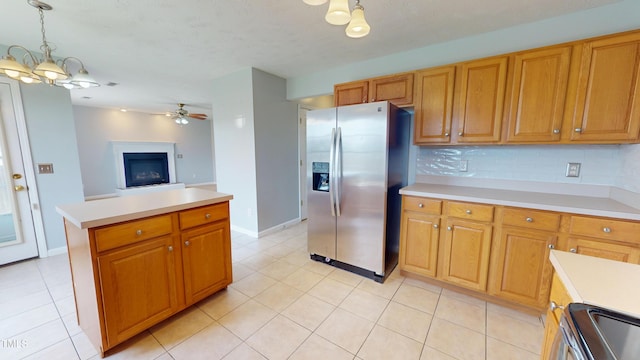 14 Gloucester Ct, Cameron, NC 28326 - kitchen with appliances with stainless steel finishes, light countertops, light tile patterned floors, a ceiling fan, and a textured ceiling