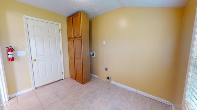 14 Gloucester Ct, Cameron, NC 28326 - laundry area with electric dryer hookup, cabinet space, washer hookup, and light tile patterned flooring