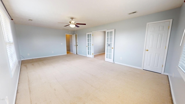 14 Gloucester Ct, Cameron, NC 28326 - unfurnished bedroom with french doors, carpet, multiple windows, and ceiling fan