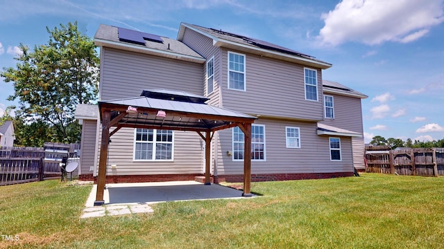 14 Gloucester Ct, Cameron, NC 28326 - back of property with roof mounted solar panels, a gazebo, a patio, and a fenced backyard