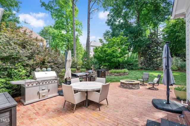 12452 Richmond Run Dr, Raleigh, NC 27614 - view of patio featuring an outdoor fire pit, outdoor dining space, and area for grilling