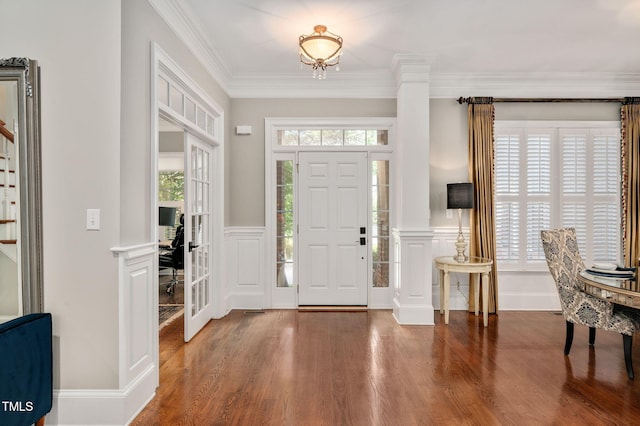 12452 Richmond Run Dr, Raleigh, NC 27614 - foyer entrance featuring wood finished floors, plenty of natural light, a wainscoted wall, crown molding, and a decorative wall