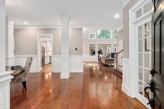 12452 Richmond Run Dr, Raleigh, NC 27614 - entryway featuring a decorative wall, crown molding, ornate columns, recessed lighting, and wood finished floors