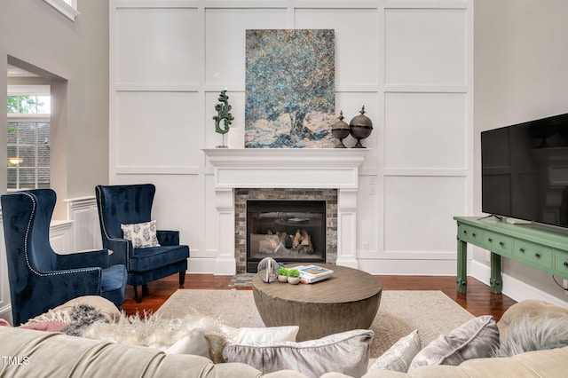 12452 Richmond Run Dr, Raleigh, NC 27614 - living area featuring a decorative wall, wood finished floors, and a fireplace