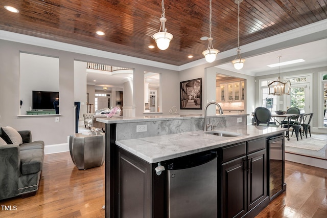 12452 Richmond Run Dr, Raleigh, NC 27614 - kitchen featuring open floor plan, beverage cooler, wood finished floors, a center island with sink, and healthy amount of natural light