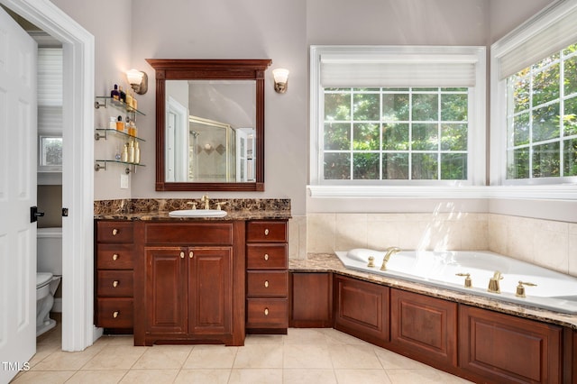 12452 Richmond Run Dr, Raleigh, NC 27614 - full bathroom featuring tile patterned flooring, a stall shower, a bath, and vanity