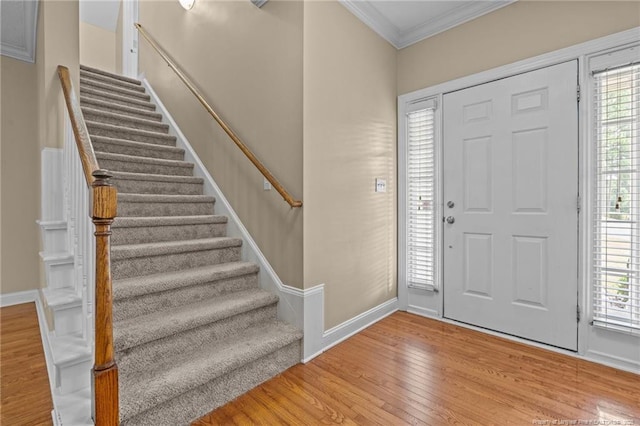 85 Shining Water Ln, Spring Lake, NC 28390 - entryway featuring ornamental molding, stairs, wood finished floors, and healthy amount of natural light
