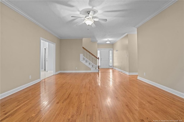 85 Shining Water Ln, Spring Lake, NC 28390 - empty room with stairway, a ceiling fan, light wood-type flooring, and crown molding