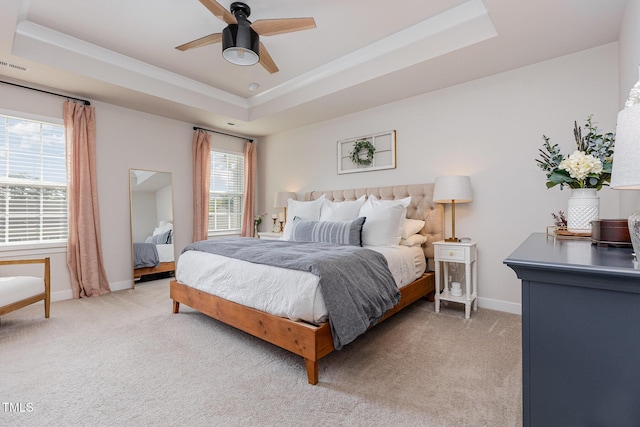 235 Misty Pike Dr, Raleigh, NC 27603 - bedroom featuring a tray ceiling, light colored carpet, and ceiling fan