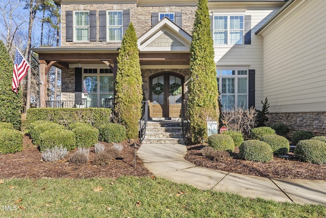 7112 Hasentree Way, Wake Forest, NC 27587 - entrance to property featuring a porch and stone siding