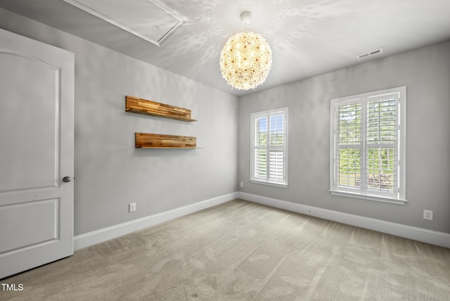 7112 Hasentree Way, Wake Forest, NC 27587 - unfurnished room with attic access, carpet flooring, and a chandelier